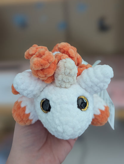 Laying unicorn plushie